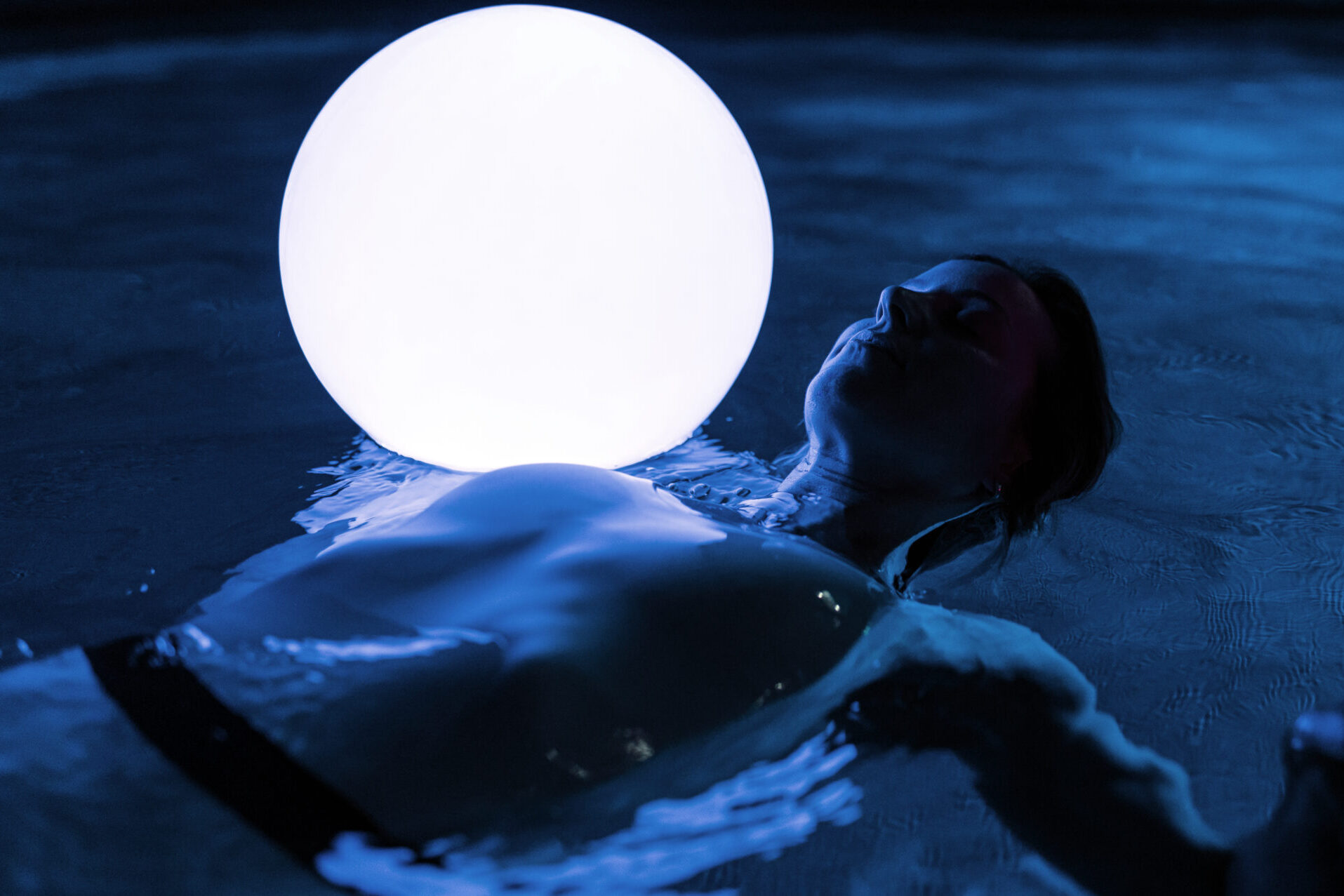 Woman relaxing in swimming pool